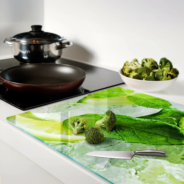 Schneidebrett glas Zitronen- und Minzblätter