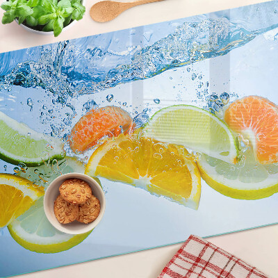 Glas-Schneidebrett mit Motiv von Zitrusfrüchten im Wasser