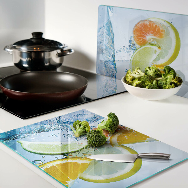 Glas-Schneidebrett mit Motiv von Zitrusfrüchten im Wasser