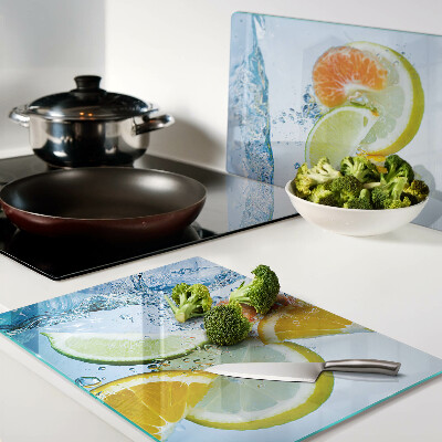 Glas-Schneidebrett mit Motiv von Zitrusfrüchten im Wasser