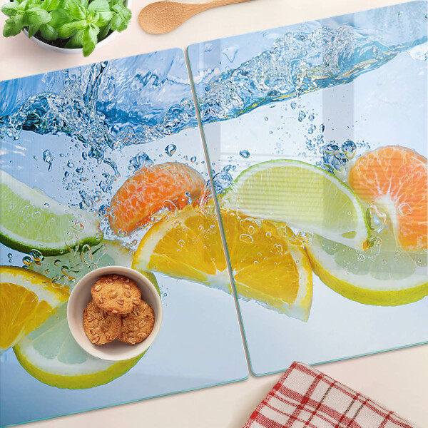 Glas-Schneidebrett mit Motiv von Zitrusfrüchten im Wasser