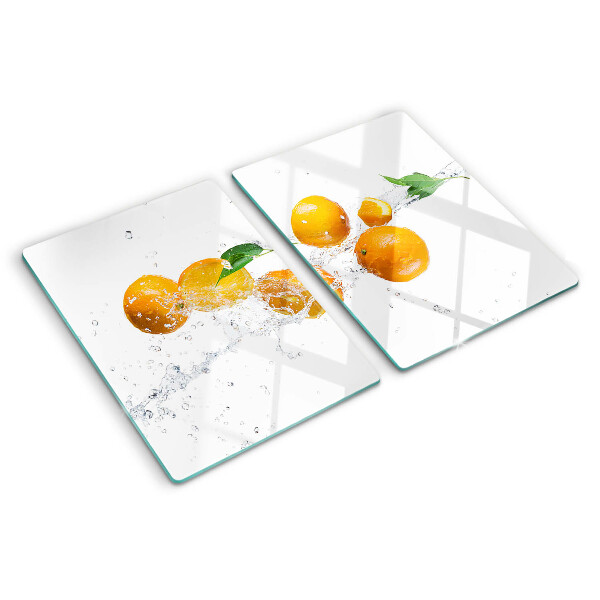 Glas-Schneidebrett mit Motiv aus Zitrusfrüchten auf Wasser