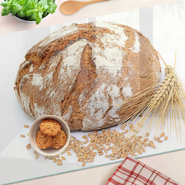 Schneidebrett mit Motiv aus Brot und Getreide
