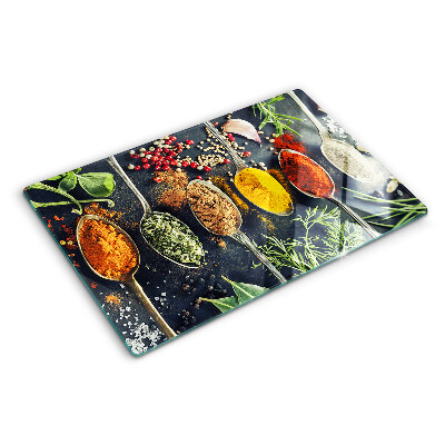 Glas-Schneidebrett mit Motiv aus Gewürzen auf Löffeln