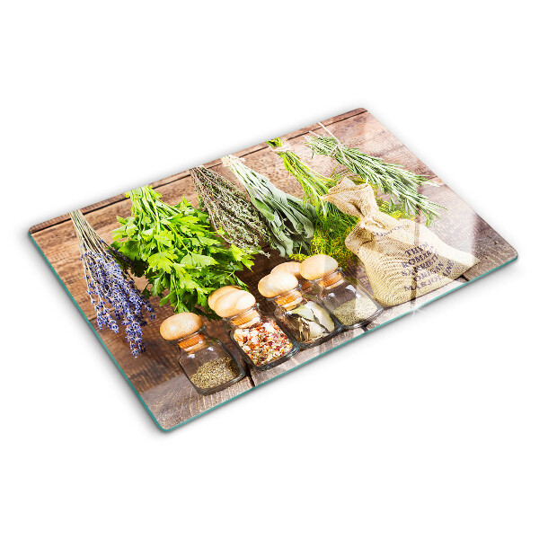 Glas schneidebrett Kräuter und Gewürze auf Holzgrund