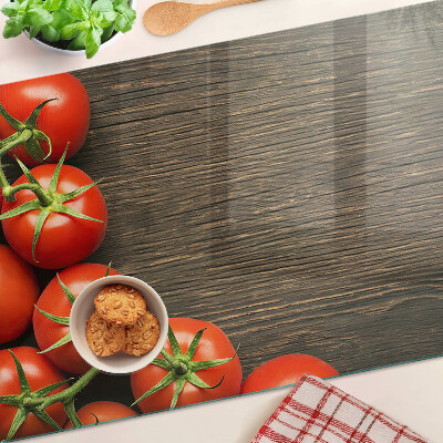 Schneidebrett mit Motiv von Tomaten auf Holzgrund