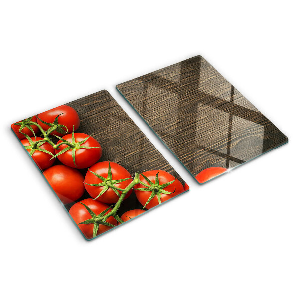 Schneidebrett mit Motiv von Tomaten auf Holzgrund