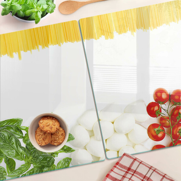 Glas Schneidebrett mit Pasta-Motiv mit Kräutern und Tomaten