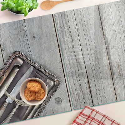 Glas Schneidebrett mit rustikalem Besteck auf Holzhintergrund