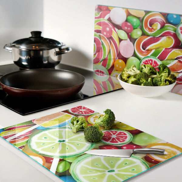 Glas schneidebrett Süßigkeiten und Früchte