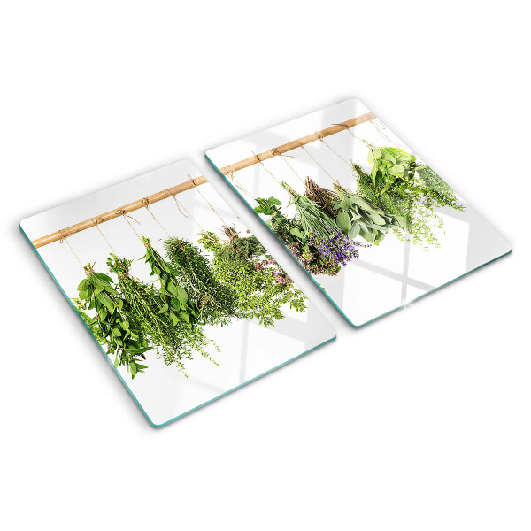 Schneidebrett Glas mit getrockneten Kräutern an einer Schnur