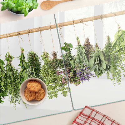 Schneidebrett Glas mit getrockneten Kräutern an einer Schnur