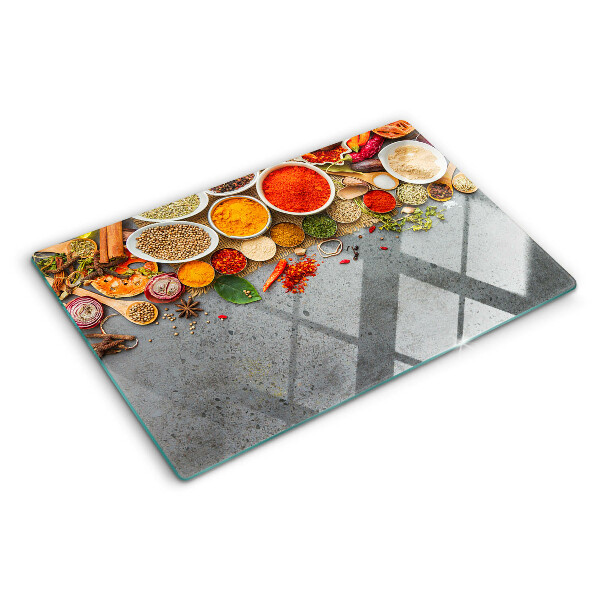 Glas-Schneidebrett mit Motiv aus Gewürzen und Kräutern