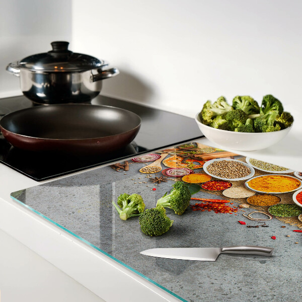 Glas-Schneidebrett mit Motiv aus Gewürzen und Kräutern