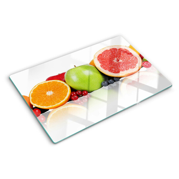 Schneidebrett mit Zitrusfrüchten in Pastellfarben