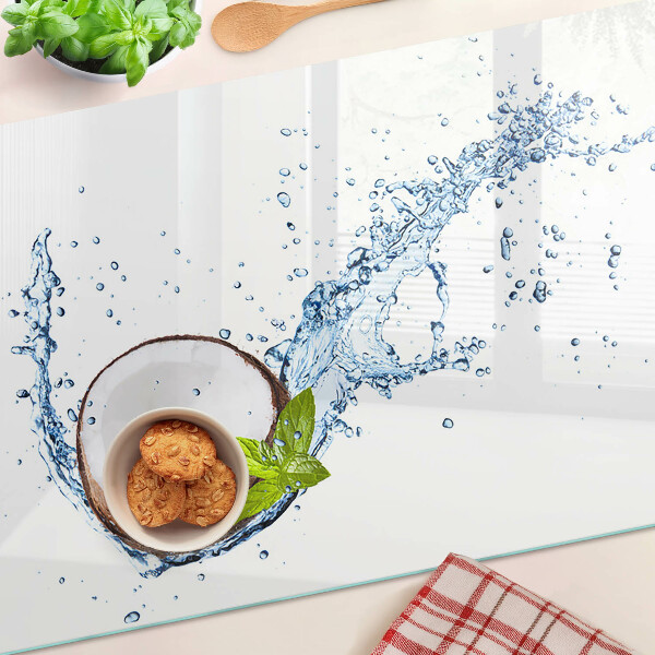 Glas Schneidebrett mit Kokosnussmotiv sowie Wasser- und Minzdekoration