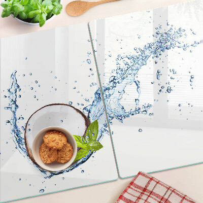Glas Schneidebrett mit Kokosnussmotiv sowie Wasser- und Minzdekoration
