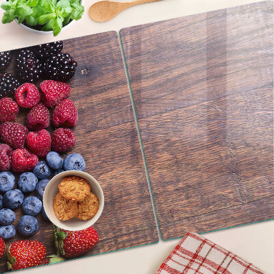 Schneidebrett glas Waldfrüchte auf Holzgrund