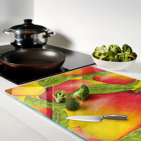 Glas schneidebrett Paprika auf grünem Blätterhintergrund