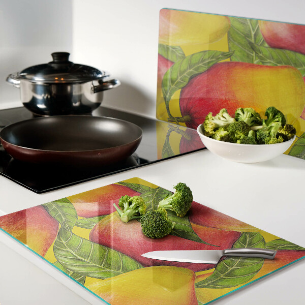 Glas schneidebrett Paprika auf grünem Blätterhintergrund