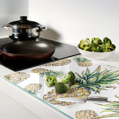 Schneidebrett Glas mit Motiv einer Ananas vor weißem Hintergrund