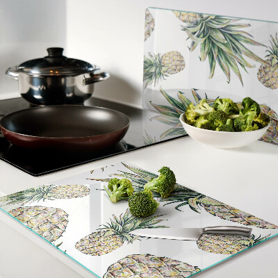 Schneidebrett Glas mit Motiv einer Ananas vor weißem Hintergrund