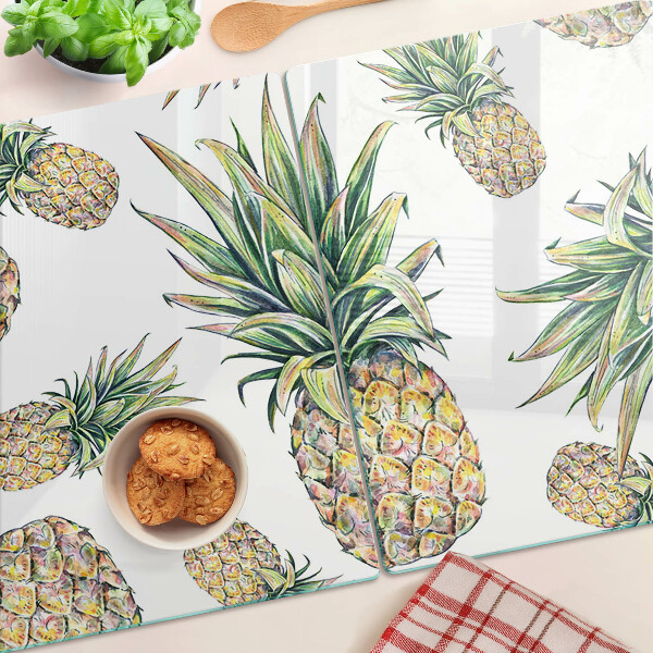 Schneidebrett Glas mit Motiv einer Ananas vor weißem Hintergrund
