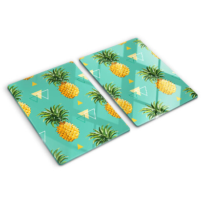 Glas-Schneidebrett mit dem Motiv einer Ananas auf türkisfarbenem Hintergrund