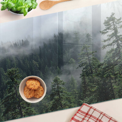 Glas-Schneidebrett mit dem Motiv „Wald in den Wolken”