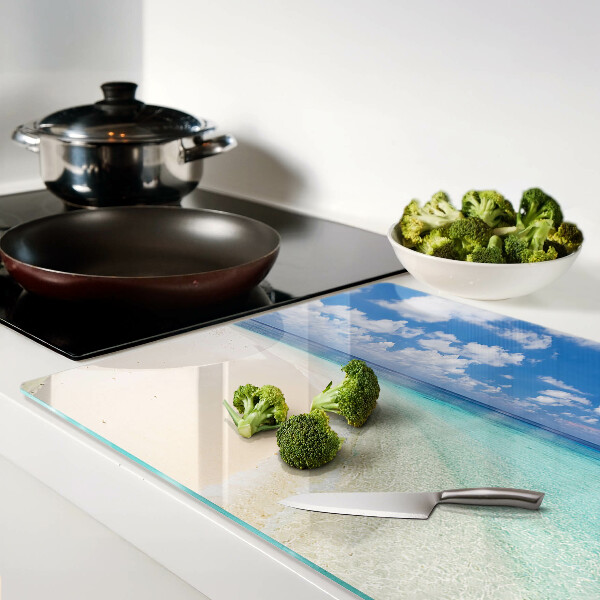 Glas schneidebrett Strand mit blauem Himmel