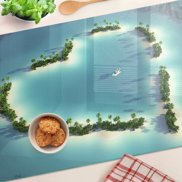 Glas-Schneidebrett mit einem Motiv einer paradiesischen Insel und Palmen