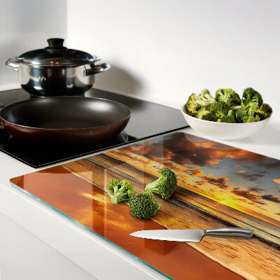 Glas-Schneidebrett mit Motiv ‚Sonnenuntergang über dem Meer‘