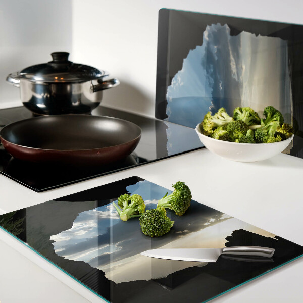 Glas schneidebrett Sonnenuntergang hinter den Wolken