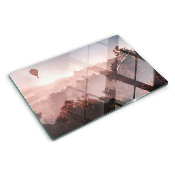 Schneidebrett Glas mit Motiv eines Heißluftballons über einer Landschaft