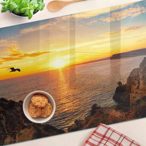 Glas-Schneidebrett mit Motiv 'Sonnenuntergang über dem Meer'