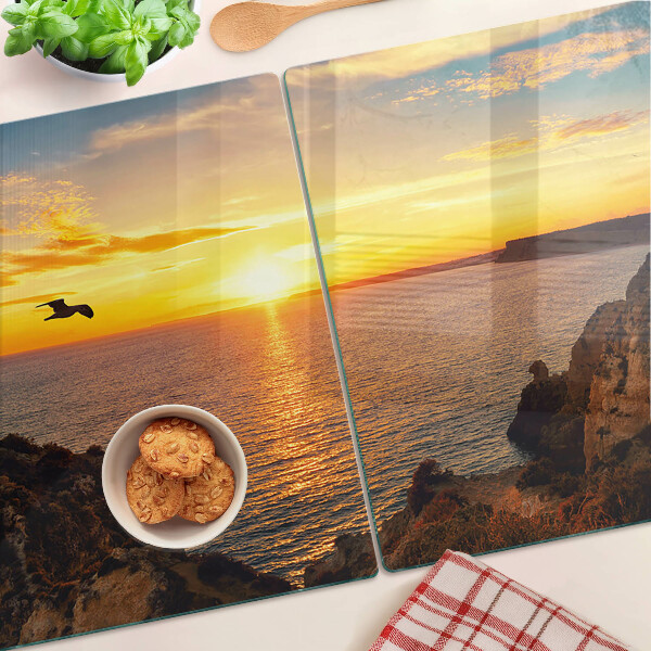 Glas schneidebrett Sonnenuntergang über dem Meer