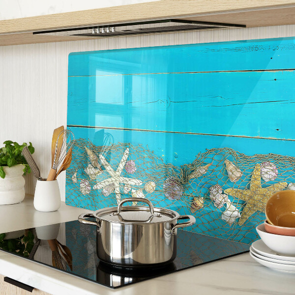 Schneidebrett mit Muschel- und Seesternmotiv in Netzoptik