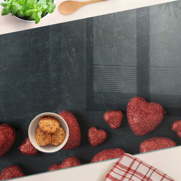 Schneidebrett glas Rote Herzen auf dunklem Hintergrund