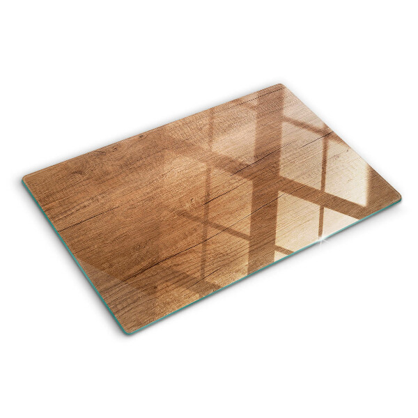 Glas-Schneidebrett mit Holzoptik und Fensterspiegelung