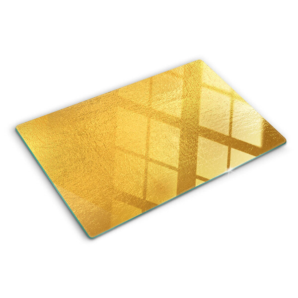 Glas-Schneidebrett mit goldfarbener, spiegelnder Oberfläche