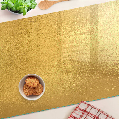 Glas schneidebrett Goldene Oberfläche mit Spiegelungen