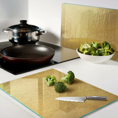 Glas schneidebrett Goldene Oberfläche mit Spiegelungen