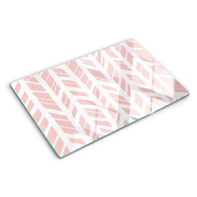 Glas-Schneidebrett mit Blättern in rosafarbenem Ton