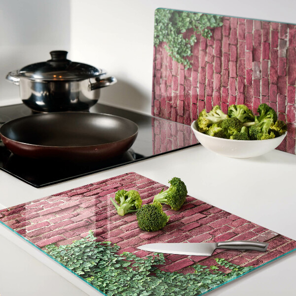 Schneidebrett Glas mit Motiv einer Ziegelmauer und Vegetation