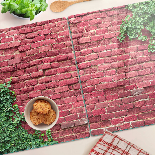 Schneidebrett Glas mit Motiv einer Ziegelmauer und Vegetation