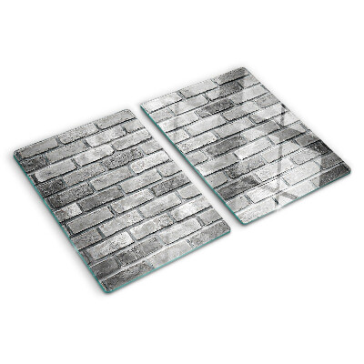 Schneidebrett mit Motiv einer Backsteinmauer in Grautönen