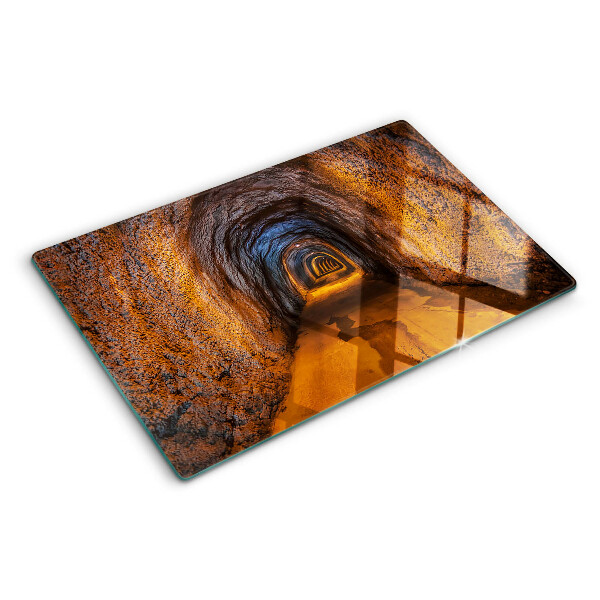 Schneidebrett Glas mit Motiv eines beleuchteten Tunnels in einer Höhle
