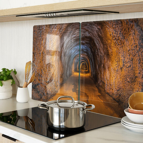 Schneidebrett Glas mit Motiv eines beleuchteten Tunnels in einer Höhle