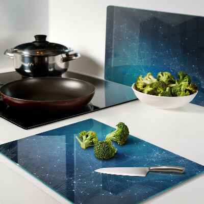 Glas-Schneidebrett mit einem Muster aus geometrischen Linien und Punkten