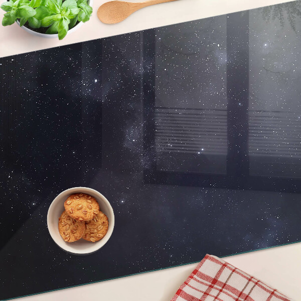 Schneidebrett Glas mit kosmischem Universum-Design und Sternmotiv